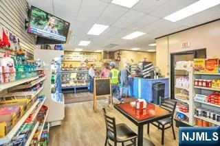 a view of a wooden bench sitting in the grass