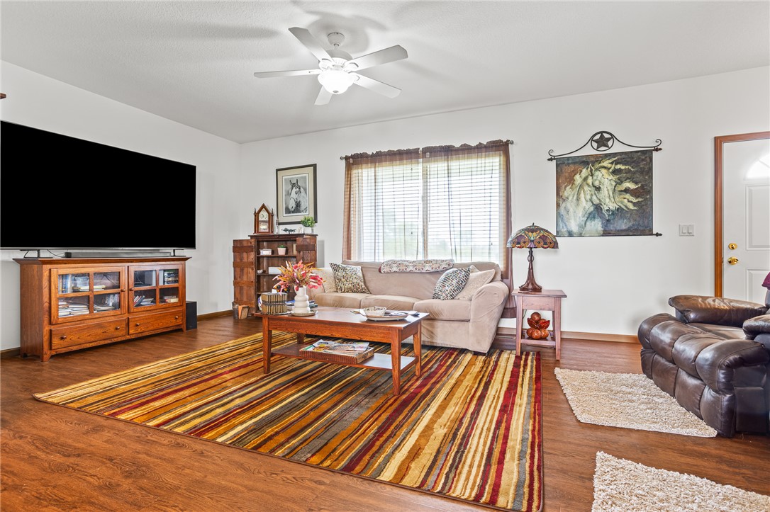 4222 Ramsey Road Springfield, OH 45502 - Photo 36 of 79 This inviting living room offers warm flooring and ample natural light, perfect for relaxation and gatherings.