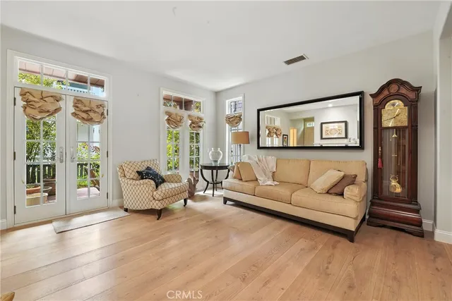 a bedroom with furniture and a flat screen tv