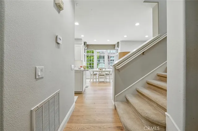 a living room with furniture a flat screen tv and a large window