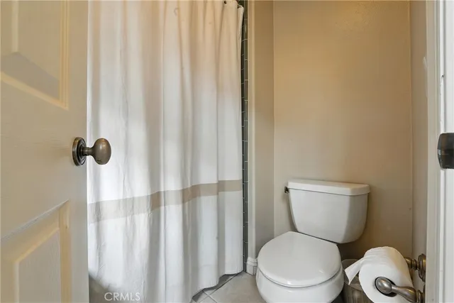 a utility room with cabinets washer and dryer