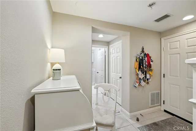 a view of a patio with chairs and plants