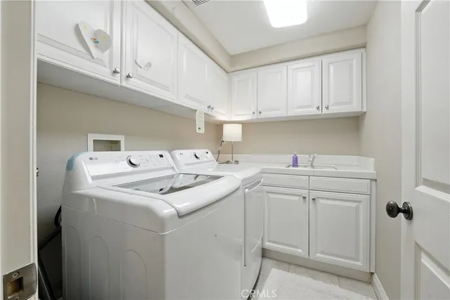 a view of a balcony with chairs and plants