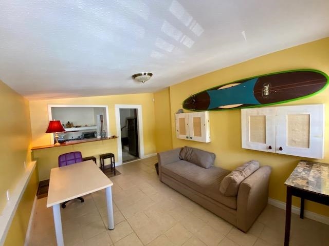 30 Olinda Road Makawao, HI 96768 - Photo 15 of 30 a living room with furniture and a flat screen tv