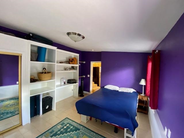30 Olinda Road Makawao, HI 96768 - Photo 16 of 30 a bedroom with a bed and a fireplace