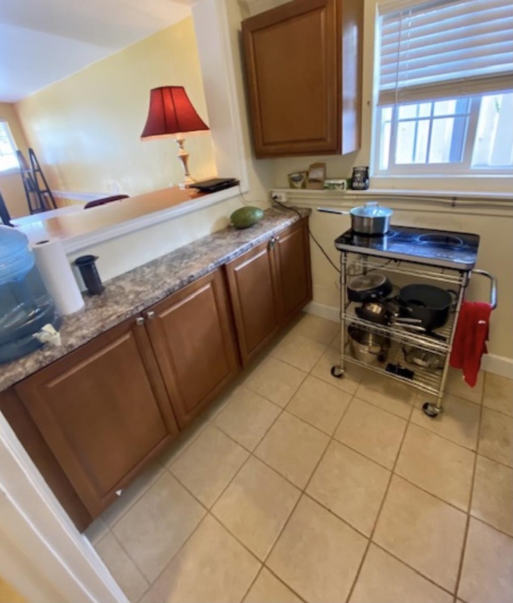 30 Olinda Road Makawao, HI 96768 - Photo 20 of 30 a kitchen with a sink a stove and a microwave