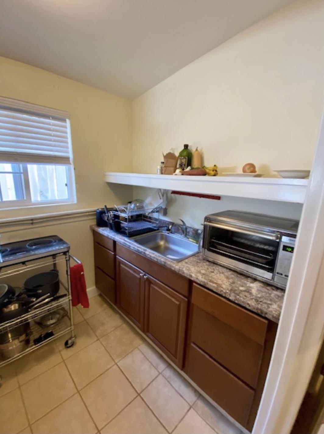 30 Olinda Road Makawao, HI 96768 - Photo 21 of 30 a kitchen with granite countertop a stove and a sink