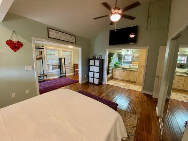 30 Olinda Road Makawao, HI 96768 - Photo 5 of 30 a bedroom with a bed and a flat screen tv
