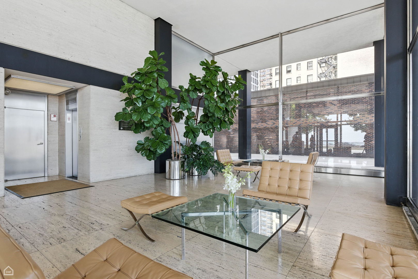 880 North Lake Shore Drive, Unit 22F Chicago, IL 60611 - Photo 18 of 21 a living room with furniture and a potted plant
