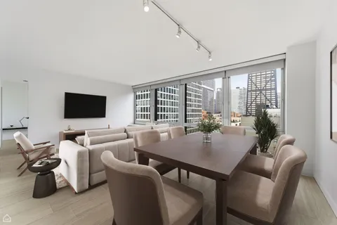 a view of a dining room with furniture window and outside view