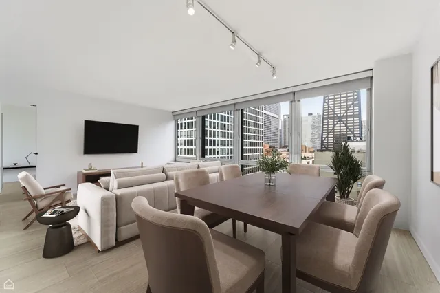 a view of a dining room with furniture window and outside view