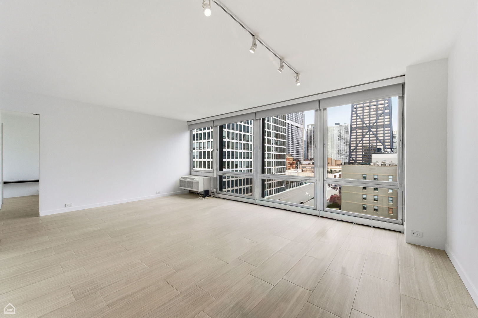 880 North Lake Shore Drive, Unit 22F Chicago, IL 60611 - Photo 6 of 21 a view of an empty room with windows and city view