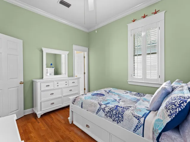 a bedroom with a bed and a dresser