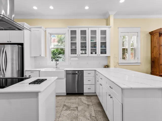 an aerial view of residential houses with outdoor space and street view