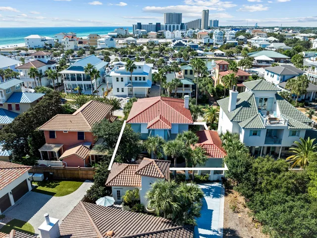 a view of a patio with table and chairs and potted plants