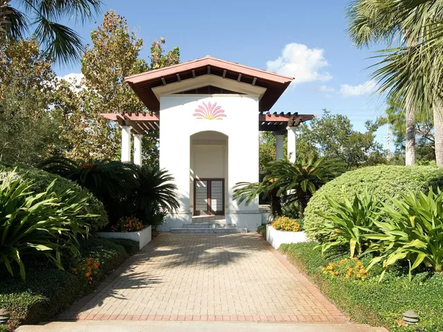 a front view of a house with iron fence