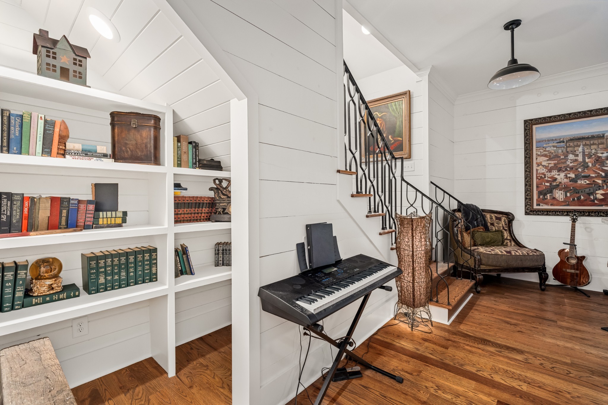5566 Hill Road Brentwood, TN 37027 - Photo 24 of 62 a living room with lots of furniture and a book shelf