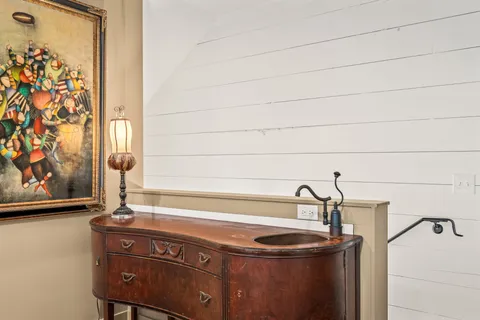 a view of a house with swimming pool and sitting area