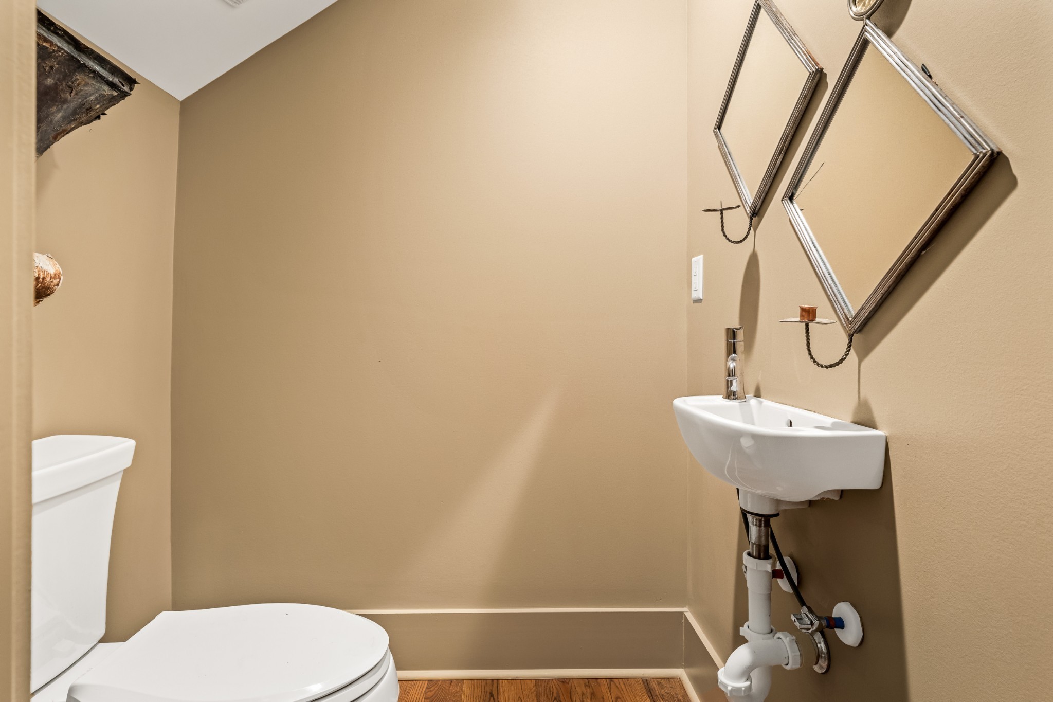 5566 Hill Road Brentwood, TN 37027 - Photo 31 of 62 a bathroom with a sink a toilet and a mirror