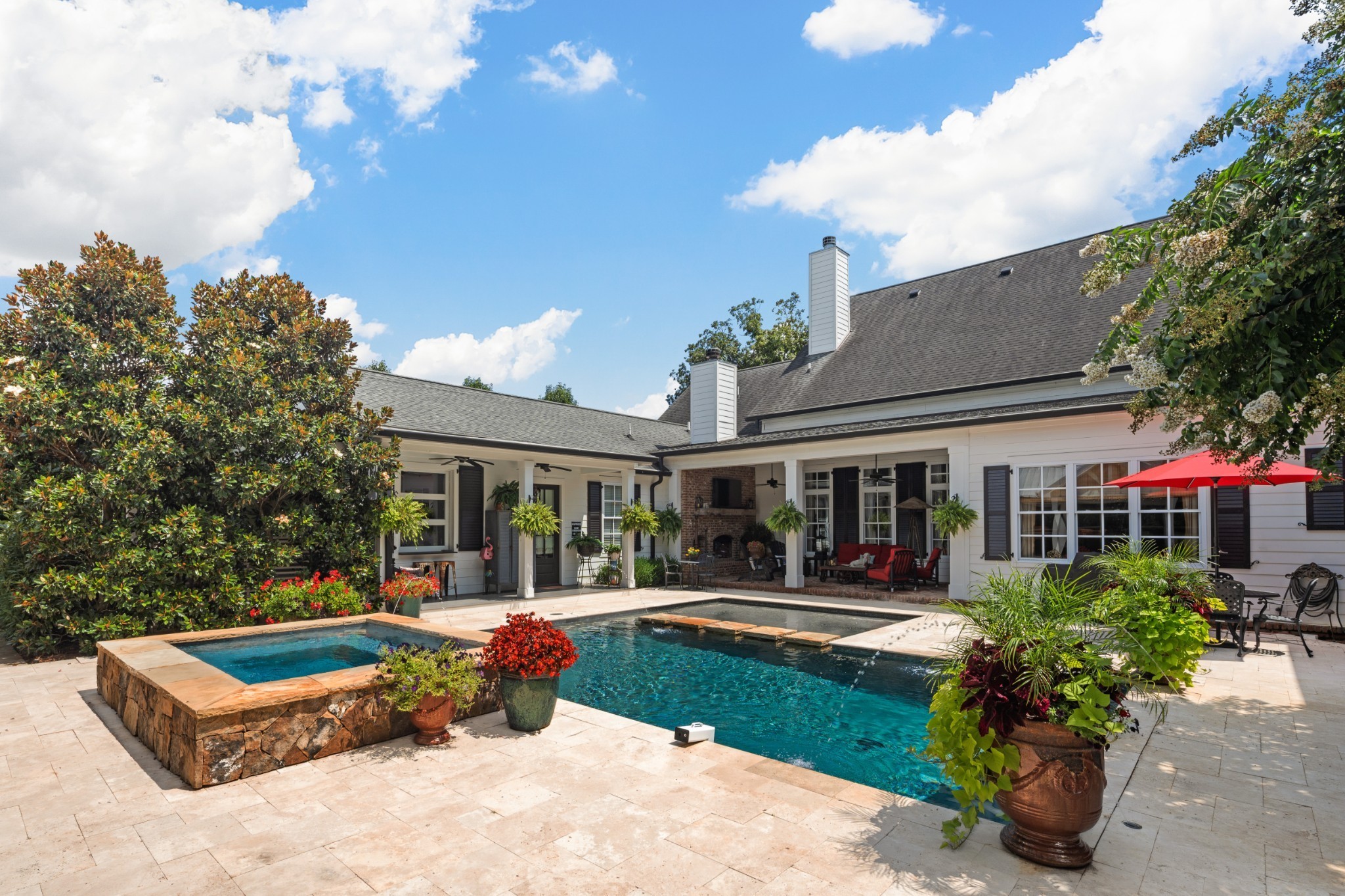 5566 Hill Road Brentwood, TN 37027 - Photo 45 of 62 a front view of a house with patio yard and outdoor seating