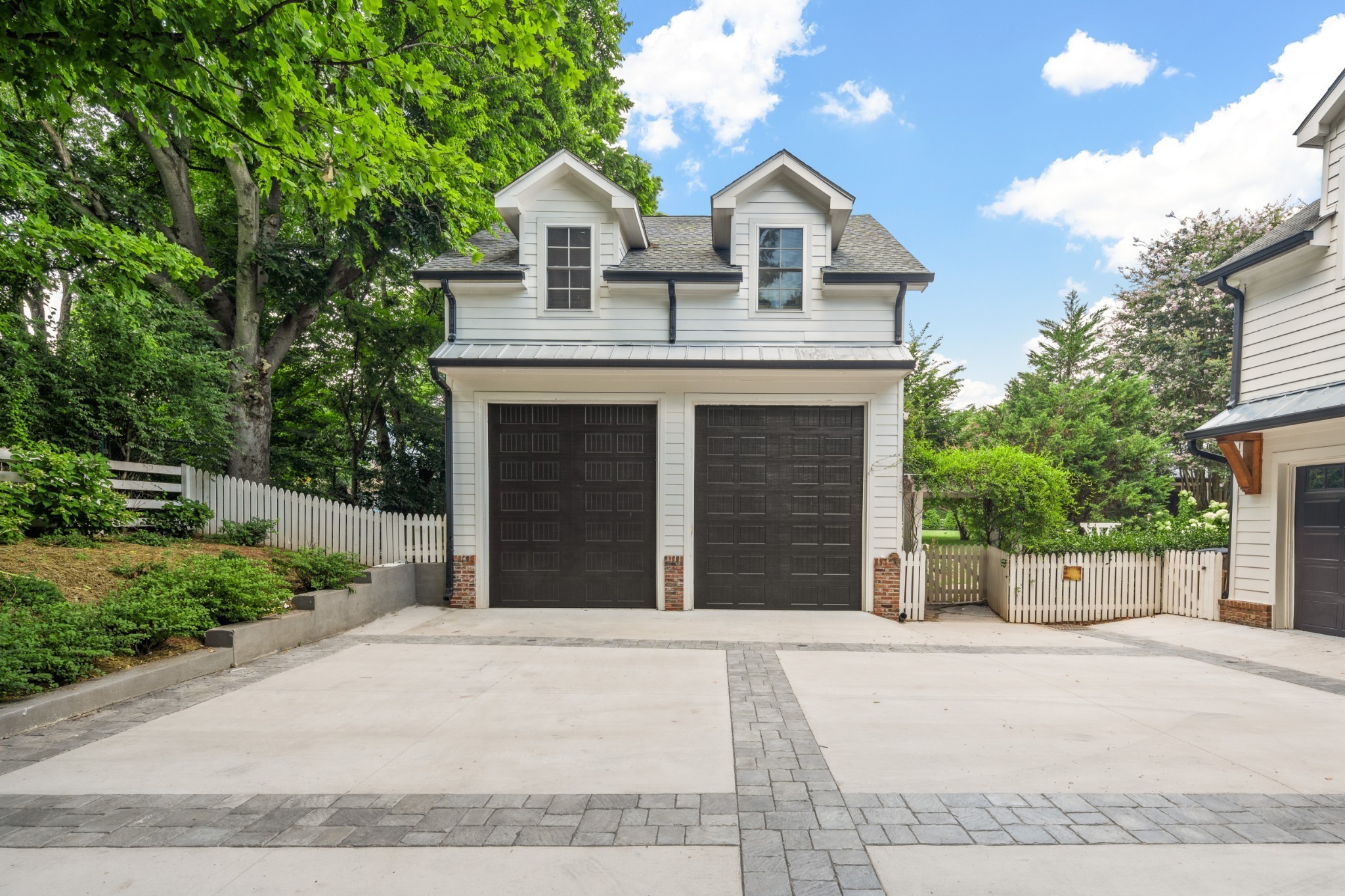 5566 Hill Road Brentwood, TN 37027 - Photo 56 of 62 a front view of a house with a yard and garage