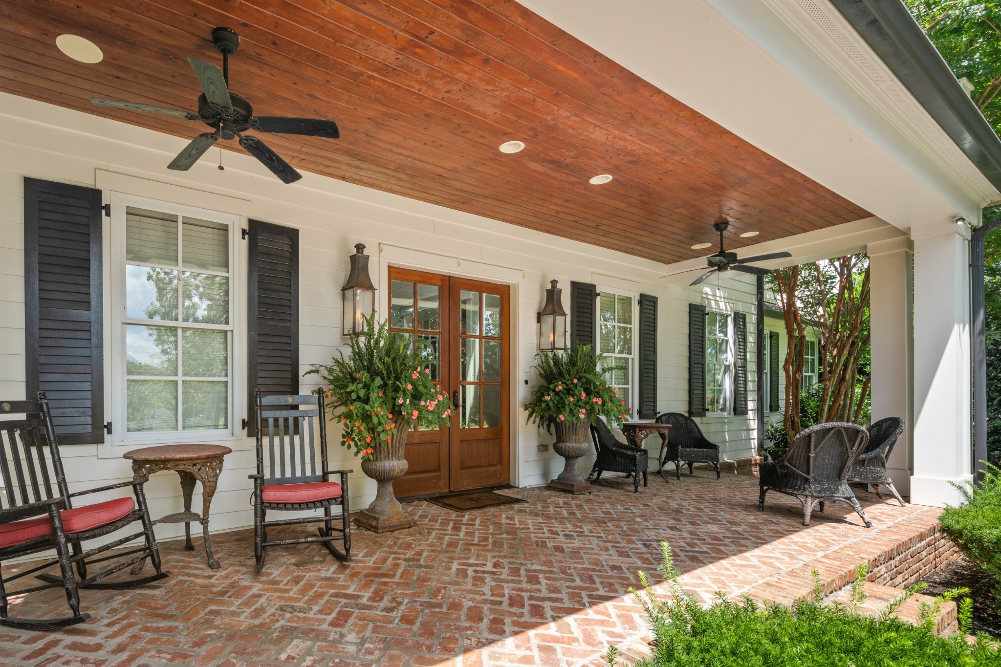 5566 Hill Road Brentwood, TN 37027 - Photo 7 of 62 a view of a patio with table and chairs potted plants and floor to ceiling window
