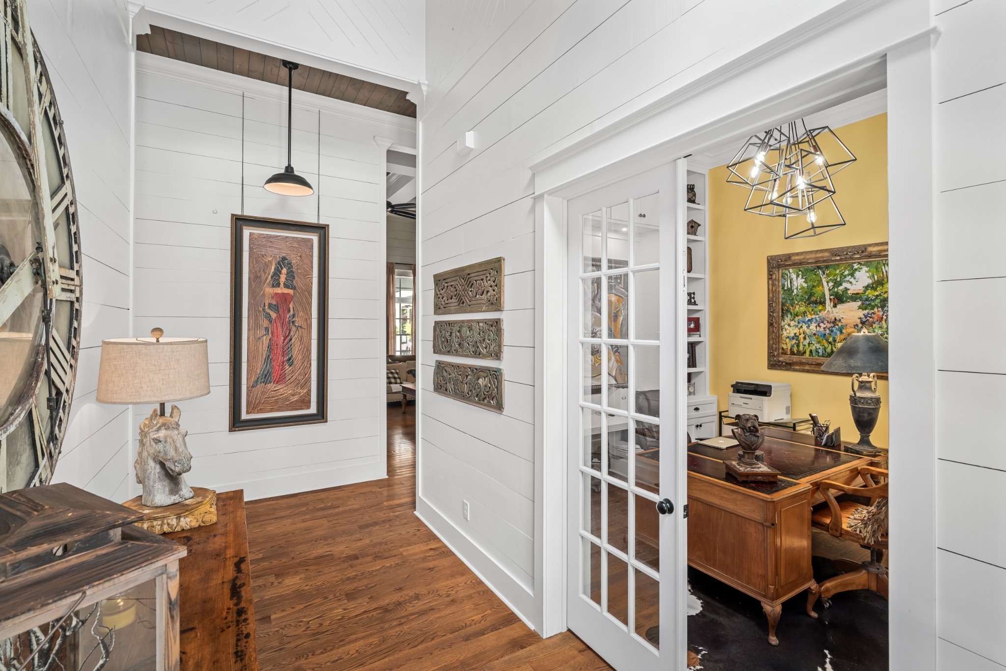 5566 Hill Road Brentwood, TN 37027 - Photo 8 of 62 a view of a hallway with wooden floor and windows