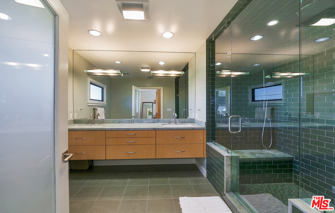3921 Cody Road Sherman Oaks, CA 91403 - Photo 17 of 36 a bathroom with a sink a toilet and shower