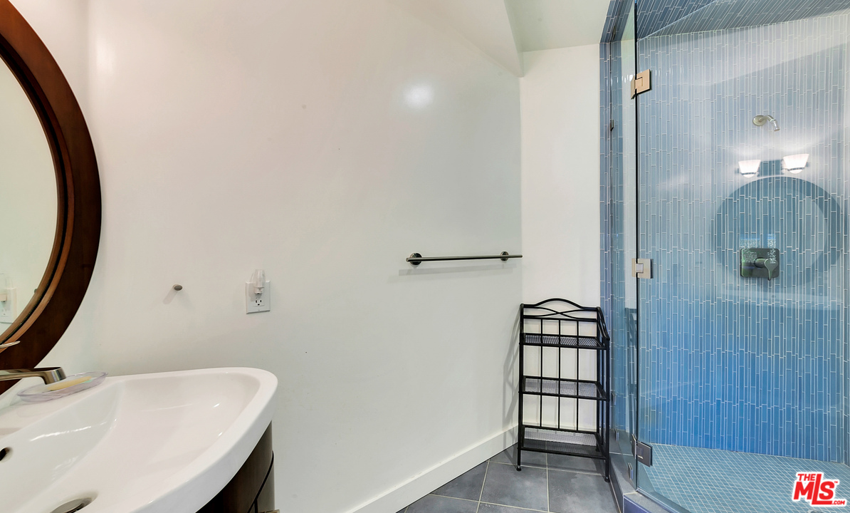 3921 Cody Road Sherman Oaks, CA 91403 - Photo 29 of 36 a bathroom with a sink a toilet and shower