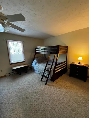 a room with gym equipment and windows