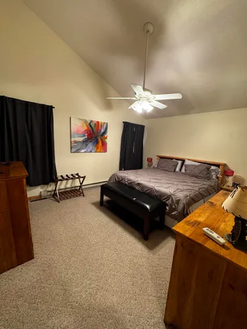 a bedroom with furniture and a chandelier
