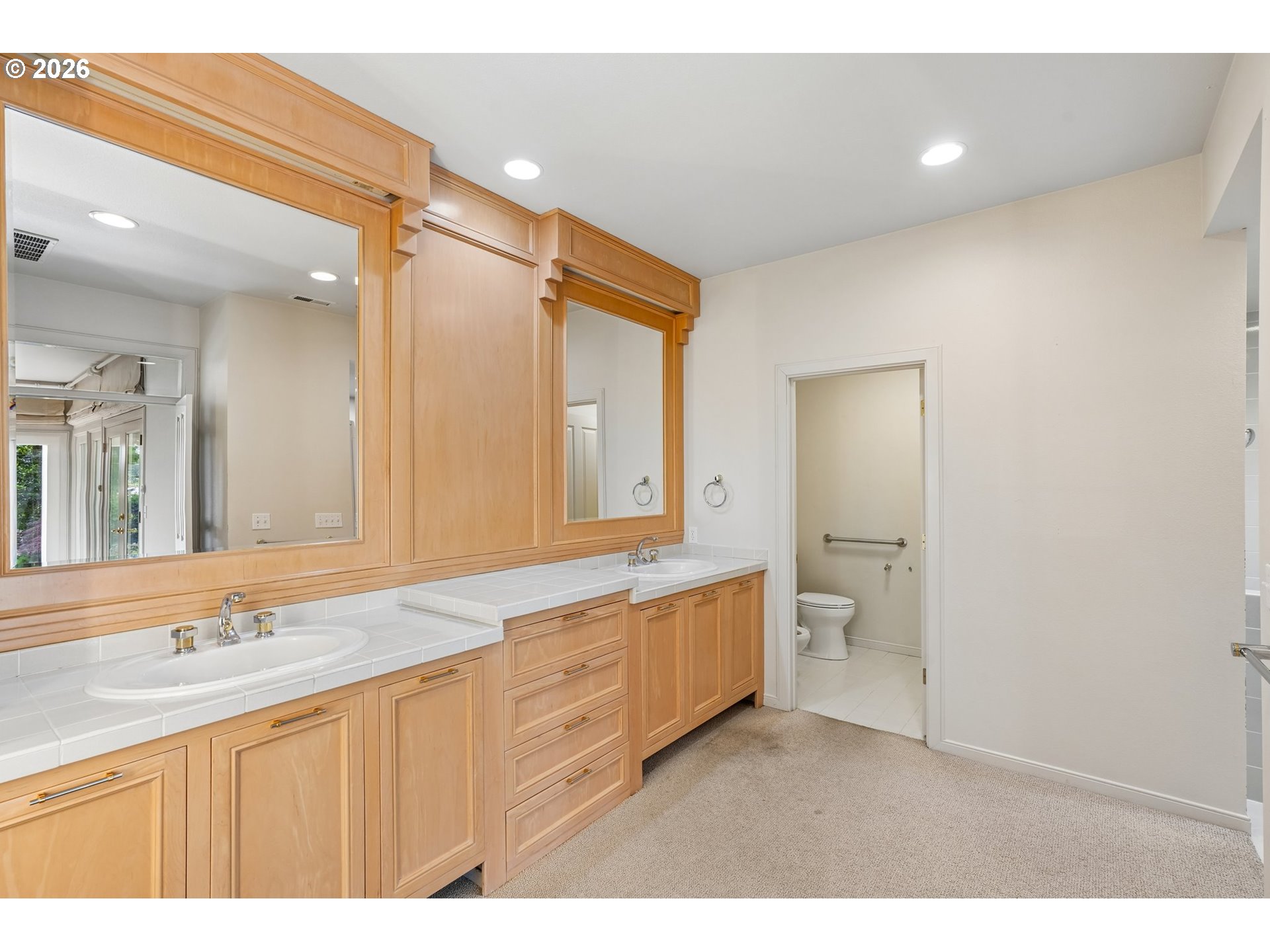 7600 Southwest Northvale Way Portland, OR 97225 - Photo 22 of 46 a bathroom with a granite countertop sink mirror and double