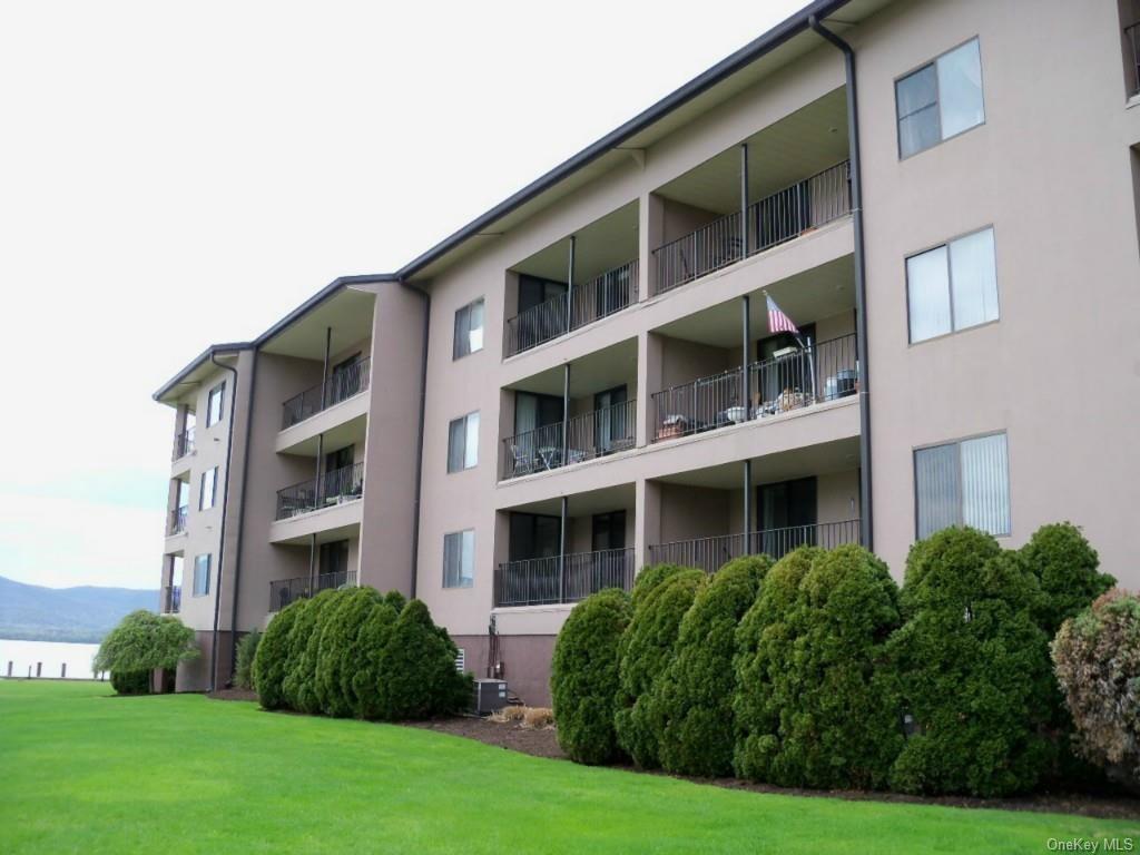 2 Park Place, Unit A3D Newburgh, NY 12550 - Photo 1 of 1 a front view of multi story residential apartment building with yard and green space