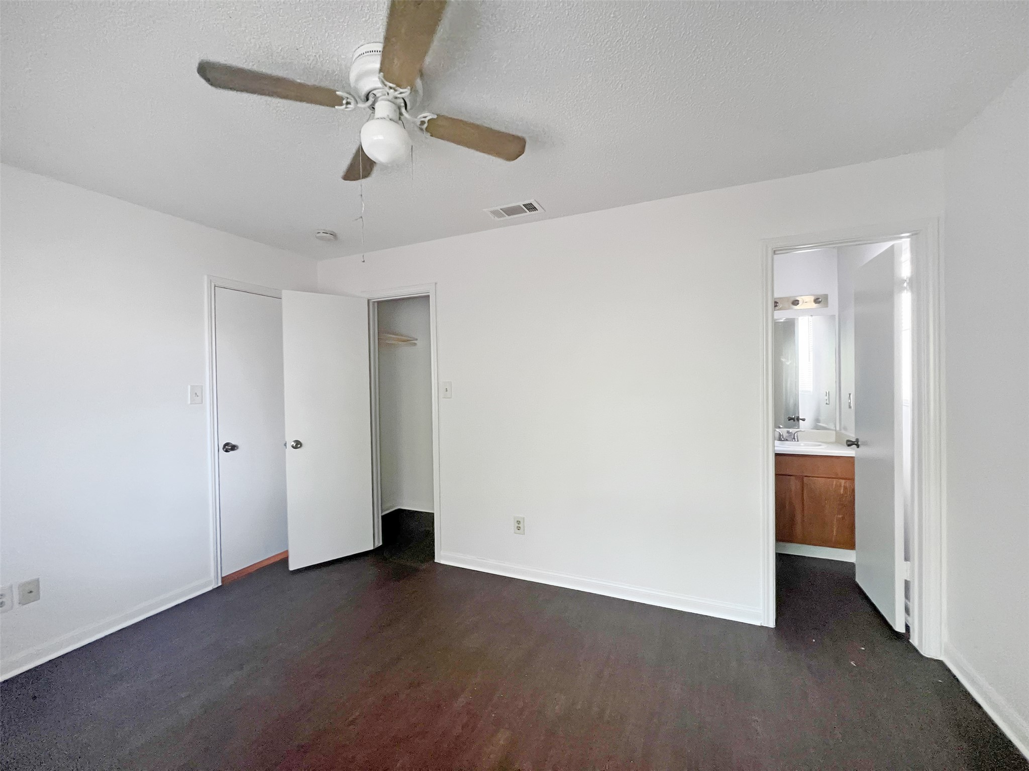 2010 Alex Avenue, Unit B Austin, TX 78728 - Photo 12 of 20 Primary Bedroom with a Walk-In-Closet and leading to the Primary Bathroom