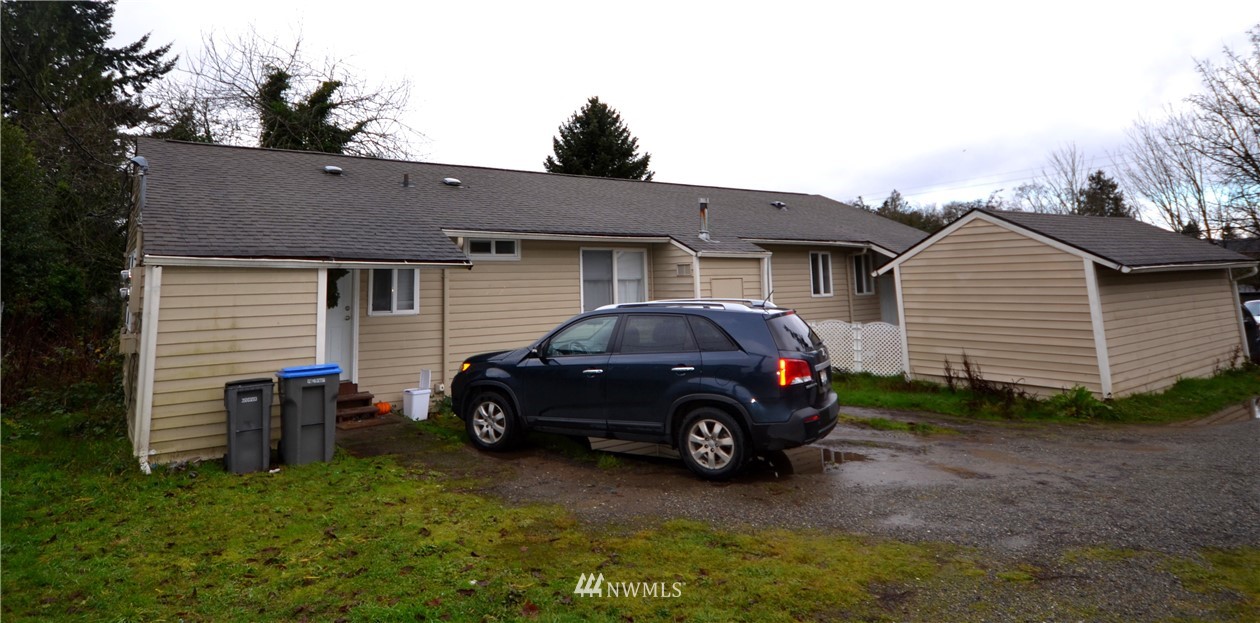 143 Sheridan Road, Unit A&B Bremerton, WA 98310 - Photo 1 of 6 a car parked in front of a house