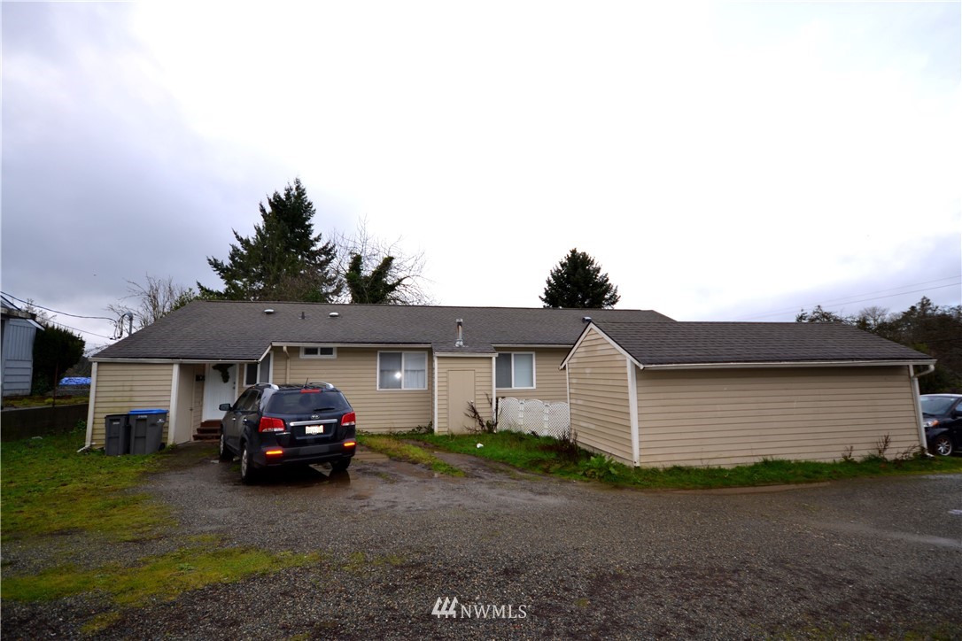 143 Sheridan Road, Unit A&B Bremerton, WA 98310 - Photo 2 of 6 a car parked in front of a house