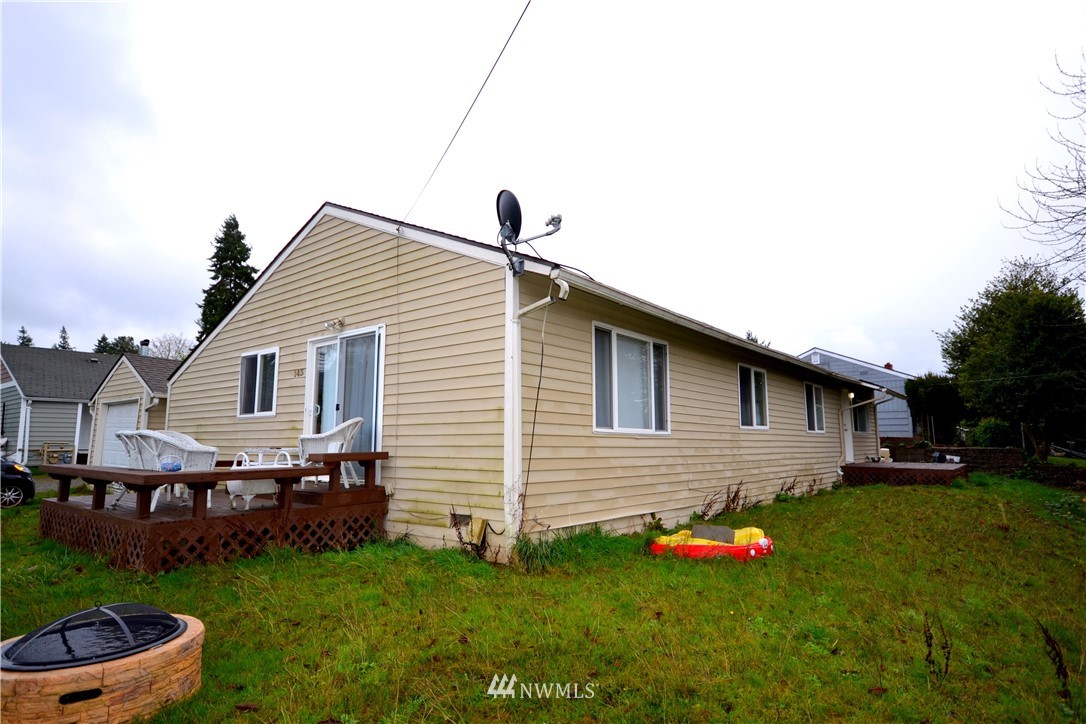 143 Sheridan Road, Unit A&B Bremerton, WA 98310 - Photo 5 of 6 a front view of house with yard and outdoor seating