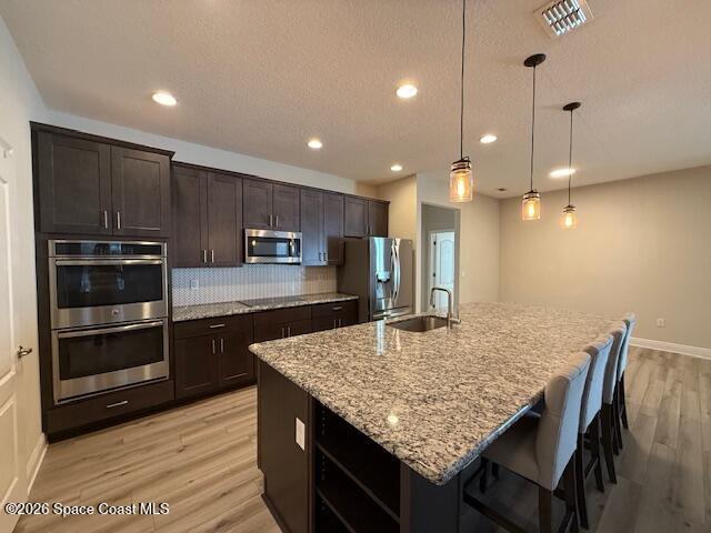 4570 Hebron Drive Merritt Island, FL 32953 - Photo 6 of 23 a kitchen with kitchen island a wooden floor and center island