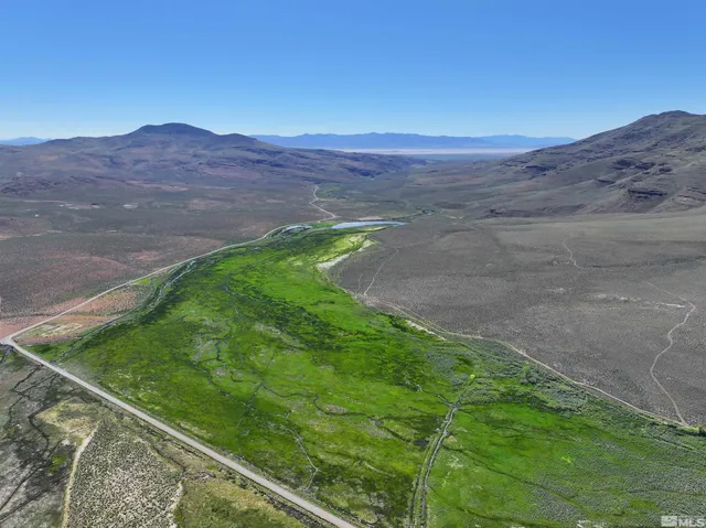 a view of a backyard with mountain view
