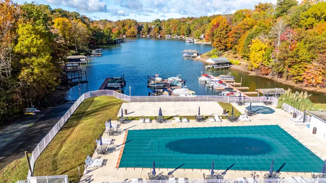 a view of a swimming pool with a yard
