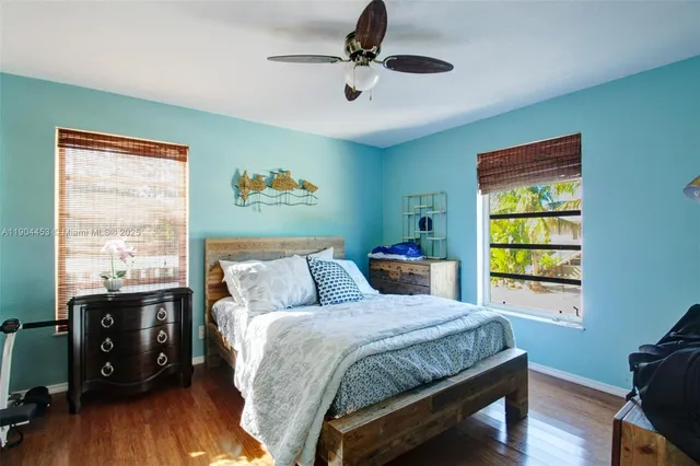 a bed room with a bed and a window