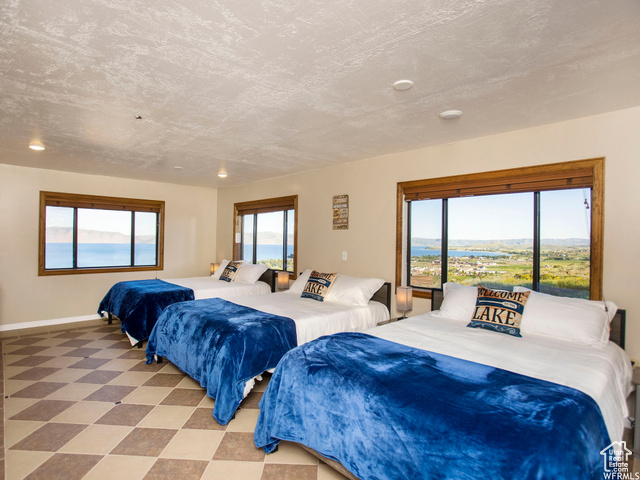 588 Raspberry Patch Road Garden City, UT 84028 - Photo 54 of 74 Bedroom with tile patterned floors and a textured ceiling