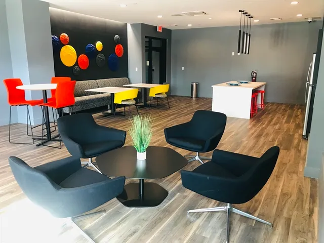 a view of a lobby with furniture and a potted plant