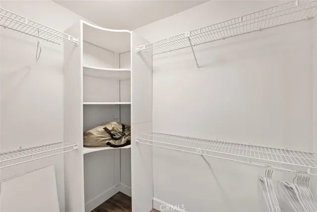 a white cabinet with white walls