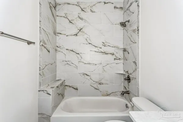 a bathroom with a sink and shower