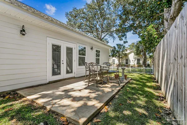 a view of a backyard with sitting area