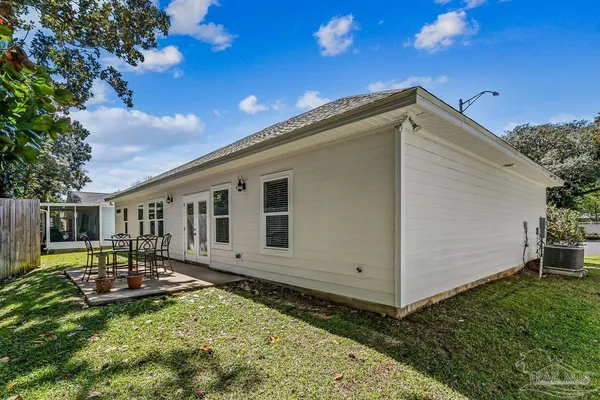 a house view with a backyard space
