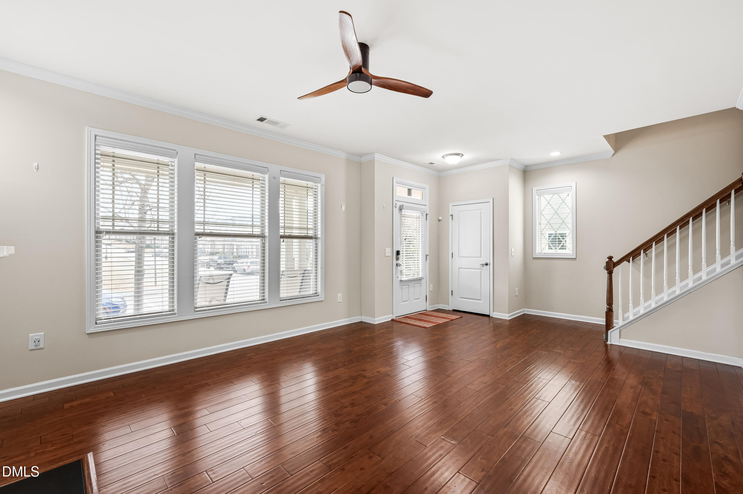 1301 Oatney Ridge Lane Morrisville, NC 27560 - Photo 10 of 38 a view of an empty room with wooden floor and a window