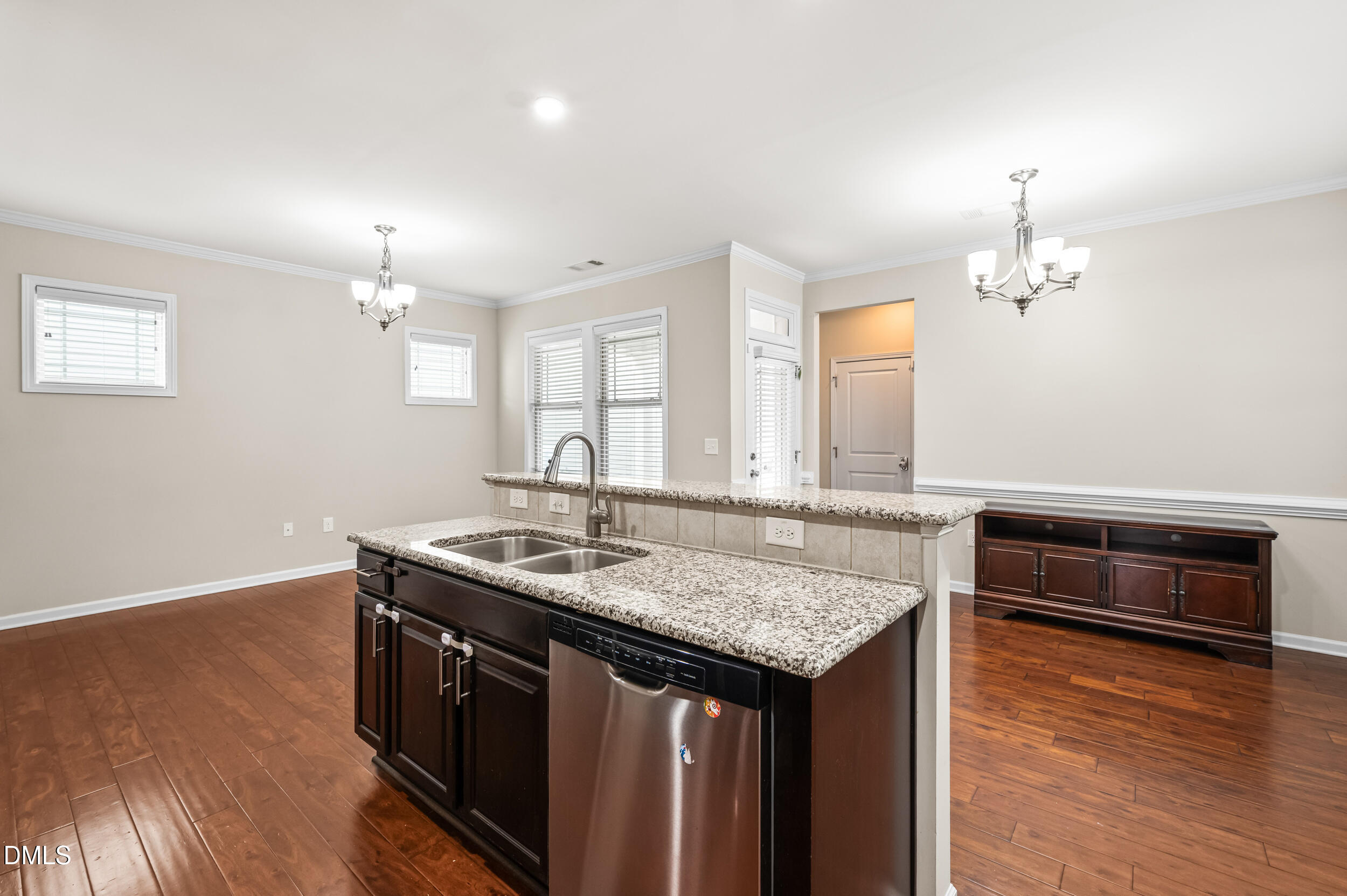 1301 Oatney Ridge Lane Morrisville, NC 27560 - Photo 13 of 38 a kitchen with a stove and a wooden floor