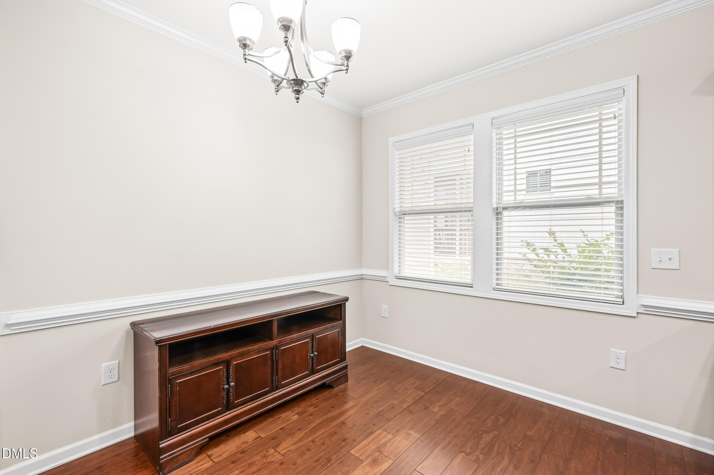 1301 Oatney Ridge Lane Morrisville, NC 27560 - Photo 17 of 38 a view of an empty room with a window and kitchen view